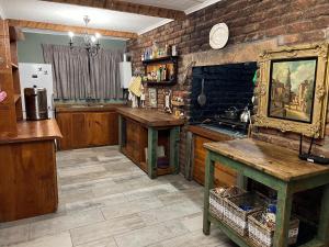 a kitchen with brick walls and a table and a counter at Perdekloof Farm in Somerset East