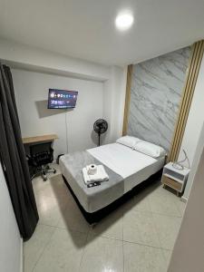 Una cama o camas en una habitación de Verde Primavera