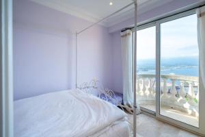 Letto o letti in una camera di Logement entier villa de luxe avec vue mer