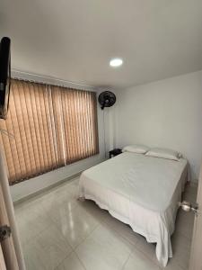 Postel nebo postele na pokoji v ubytování Apartahotel Nueva Imagen