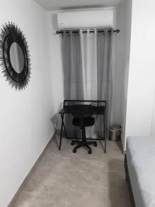 a bedroom with a table and a mirror and a bed at AWESOME PLACe in Las Vegas