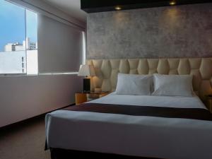 Katil atau katil-katil dalam bilik di Hotel Ferré Miraflores