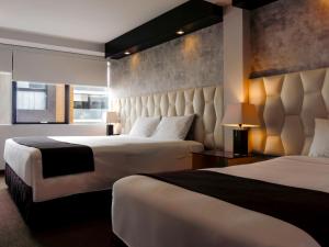 Katil atau katil-katil dalam bilik di Hotel Ferré Miraflores