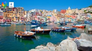a group of boats in a harbor with buildings at Casa Vacanze Aurelia in Procida
