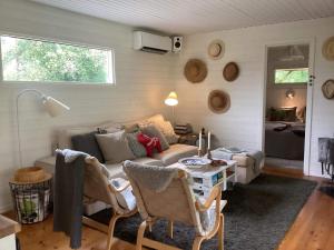 a living room with a couch and a table at 4 star holiday home in HOLSLJUNGA in Holsljunga