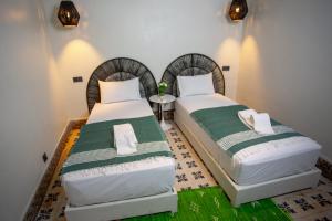 Postel nebo postele na pokoji v ubytování Riad Tawja