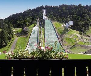 a view of a large waterfall in a park at Olympiahaus in Garmisch-Partenkirchen