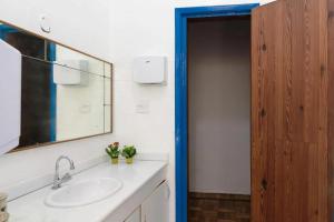 a bathroom with a sink and a mirror at Maracanã Hostel Sport Bar in Rio de Janeiro +34 photos