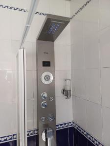 a shower in a bathroom with a shower at Hostel Nature in Zambujeira do Mar