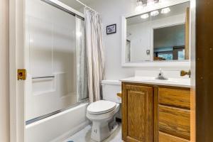 a bathroom with a toilet and a sink and a shower at West Dover Townhome Hot Tub, 2 Mi to Mount Snow! in West Dover +17 photos