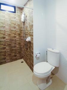 a bathroom with a toilet and a shower at Huahin City View in Hua Hin