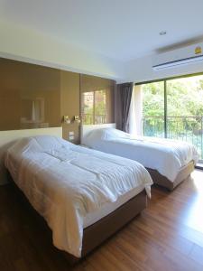 Postel nebo postele na pokoji v ubytování Huahin City View