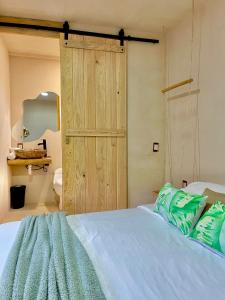 Postel nebo postele na pokoji v ubytování Hotel Casa Maakjä
