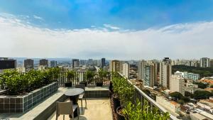 a balcony with a view of a city at 360 VN Turiassú by Housi in Sao Paulo +211 photos