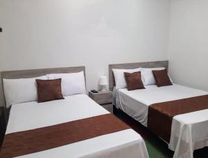 Voodi või voodid majutusasutuse Hotel Cafetto toas