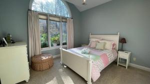 a childs bedroom with a bed and a large window at Ruffino Retreat in Union Pier +47 photos