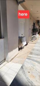 a herpes sign on the side of a building at Rei's room in the city center in Durrës