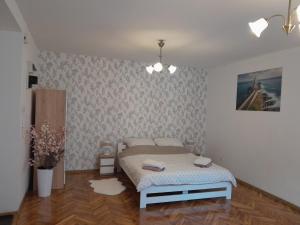 a bedroom with a bed in a room at Apartament w Centrum Miasta, blisko Dworcu in Przemyśl +15 photos