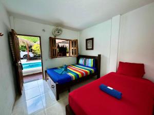 Hostal Nibuni Palomino客房内的一张或多张床位
