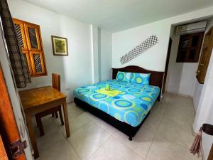 Hostal Nibuni Palomino客房内的一张或多张床位