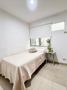 Ένα ή περισσότερα κρεβάτια σε δωμάτιο στο Habitacion