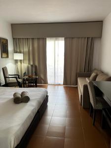 Кровать или кровати в номере Domina Coral Bay Sultan