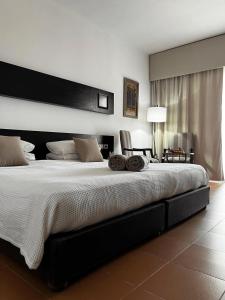 Кровать или кровати в номере Domina Coral Bay Sultan