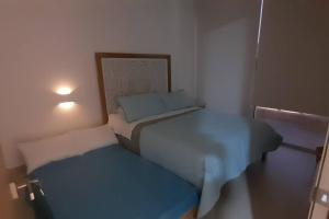 Postel nebo postele na pokoji v ubytování Alemaus Suite Cartagena