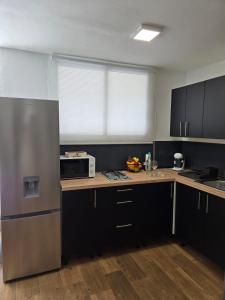 Kuchyň nebo kuchyňský kout v ubytování Apartamento Sun&Beach