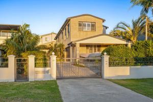 a gate in front of a house at Seaside Haven on Hutton Road in The Entrance