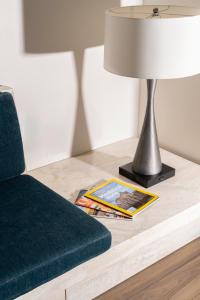 a lamp sitting on a table next to a couch at Chicken Ranch Casino Resort in Jamestown