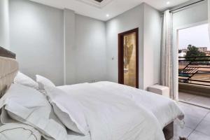 Ένα ή περισσότερα κρεβάτια σε δωμάτιο στο La Maison H 002