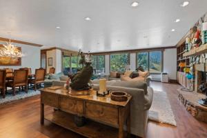a living room with a couch and a table at McCoy Peak 305 by East West Hospitality in Beaver Creek