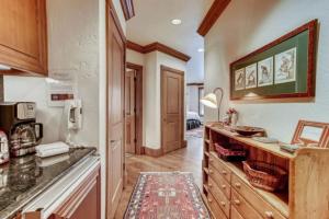 a kitchen with a sink and a counter top at McCoy Peak 202 by East West Hospitality in Beaver Creek