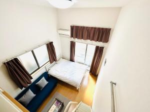Postel nebo postele na pokoji v ubytování Tokyo Enjoy Hotel