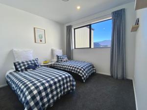 Postel nebo postele na pokoji v ubytování Luxurious Twizel Escape