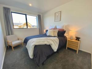 Postel nebo postele na pokoji v ubytování Luxurious Twizel Escape