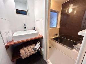 a small bathroom with a sink and a tub at tot-an 14mins from Toyama station #HH7 in Toyama Station