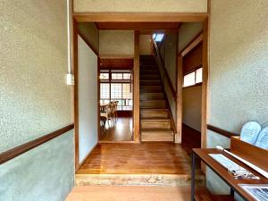 a hallway of a house with stairs and a table at tot-an 14mins from Toyama station #HH7 in Toyama Station