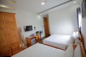 TV a/nebo společenská místnost v ubytování Arya Hotel Dalat