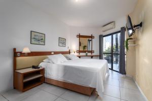 Un pat sau paturi într-o cameră la Residence Real Copacabana - 120 - Piscina, Academia e Varanda com Vista +48 fotografii