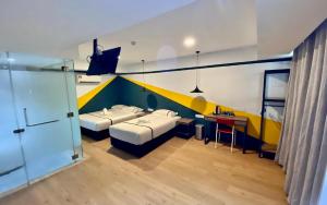Postel nebo postele na pokoji v ubytování Seeds Hotel Selayang + 8 fotografií