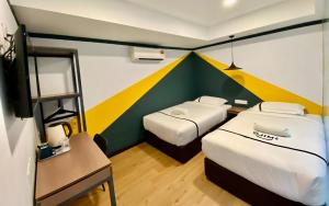 Postel nebo postele na pokoji v ubytování Seeds Hotel Selayang