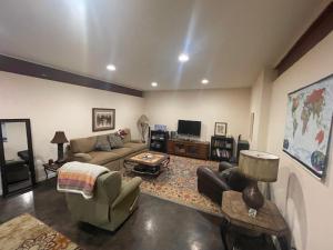 a living room with a couch and a table at River Mountain Getaway-private, large, in- law apt in Jamestown