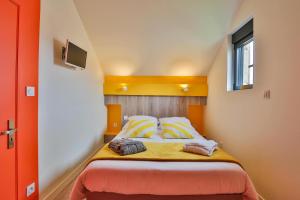 Postel nebo postele na pokoji v ubytování CHALET CARAIBES SPA Privatif + 5 fotografií