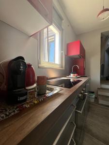 a kitchen with a sink and a counter top at A casa di Linda in Tivoli