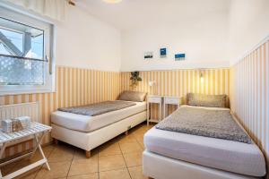 Postel nebo postele na pokoji v ubytování Ferienhaus Sommerrose