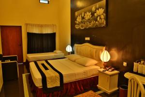 Letto o letti in una camera di Miridiya Lake Resort