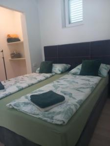 Posteľ alebo postele v izbe v ubytovaní Apartman Marita