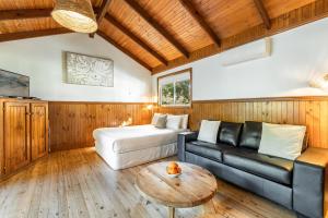 a living room with a couch and a table at BIG4 Saltwater Yamba Holiday Park in Yamba